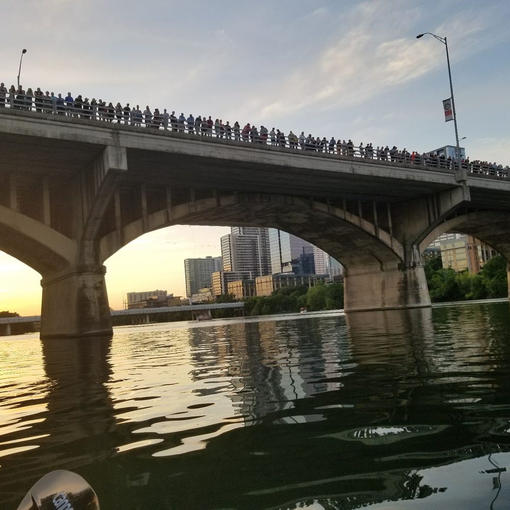 Lone Star Kayak Tours - All the people on the bridge waiting for bats vs us waiting on water and boats - Paddleboarding Near Me - Austin, Texas Lone Star Kayak Tours - All the people on the bridge waiting for bats vs us waiting on water and boats - Paddleboarding Near Me - Austin, Texas