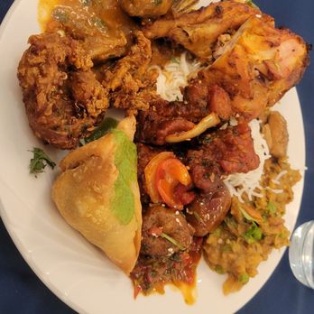 Mirchi Massala - Samosa, veggie pakora, chili chicken, tandoori chicken, basmati rice, and goat curry - Indian Near Me - Fresno, California