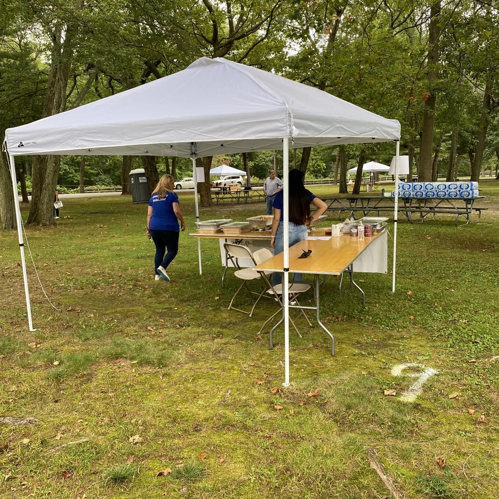 Empanada Fest - two people at a table under a tent - Food Trucks Near Me - Pawtucket, Rhode Island Empanada Fest - two people at a table under a tent - Food Trucks Near Me - Pawtucket, Rhode Island
