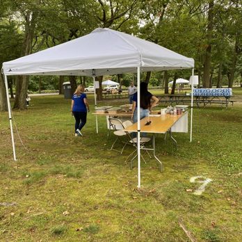Empanada Fest - two people at a table under a tent - Food Trucks Near Me - Pawtucket, Rhode Island