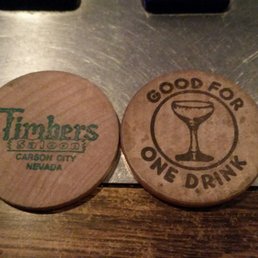two wooden coasters on a table two wooden coasters on a table