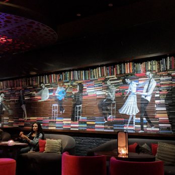 The Tuck Room - Bookshelf mural with real books - Cocktail Bars Near Me - North Miami Beach, Florida