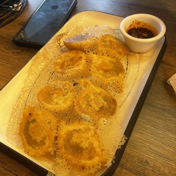 Southside Dumpling Haus - Beef Pan fried Dumplings upside down. - Chinese Near Me - Corpus Christi, Texas Southside Dumpling Haus - Beef Pan fried Dumplings upside down. - Chinese Near Me - Corpus Christi, Texas