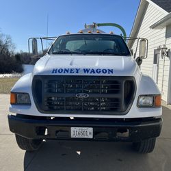 Huggins Elroy Septic Tank Serv - The septic truck