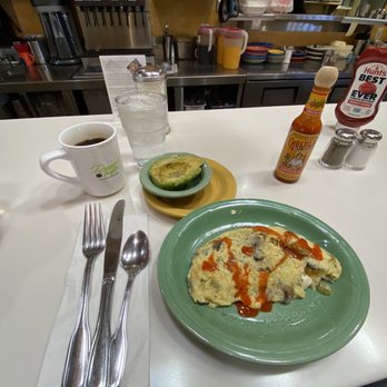 The Griddle - Sausage, cheddar, mushroom omelette with a side of avocado and a black coffee. - Breakfast & Brunch Near Me - Meridian, Idaho The Griddle - Sausage, cheddar, mushroom omelette with a side of avocado and a black coffee. - Breakfast & Brunch Near Me - Meridian, Idaho
