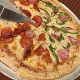 Lg ham, pepperoni, and green peppers with a butter cheese crust Lg ham, pepperoni, and green peppers with a butter cheese crust