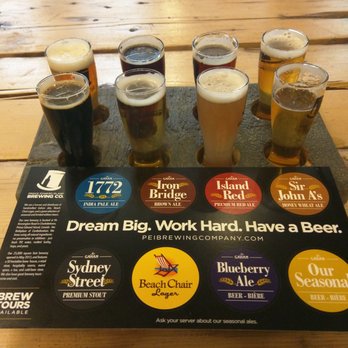 PEI Brewing Company - a flight of beers on a table - Breweries Near Me - Charlottetown, Prince Edward Island