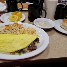 an omelet and biscuits on a table an omelet and biscuits on a table