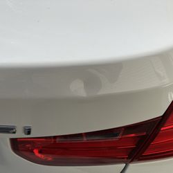 Dingsmith Paintless Dent Removal - BMW upper trunk lid ding