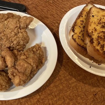 Sizzler - Brought to the table- chicken wings and parmesan cheese toast. - Seafood Near Me - Colma, California