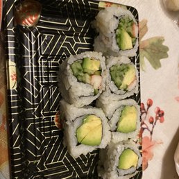 a plate of sushi rolls with avocado a plate of sushi rolls with avocado