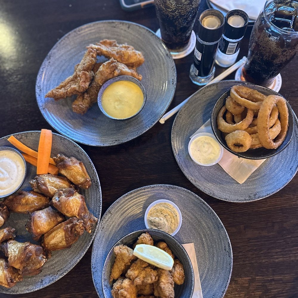 House wings, chicken strips, onion rings and grouper bites House wings, chicken strips, onion rings and grouper bites