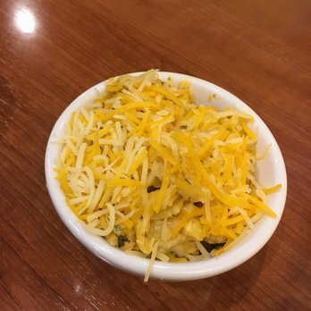 Dame's Chicken and Waffles - Macaroni and cheese but the cheese isn't melted. The herbs really give it an awkward taste for me and mine was kind of dry. - New American Near Me - Cary, North Carolina