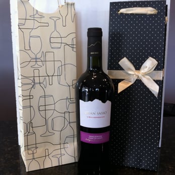 The Cork Stop - a bottle of wine next to a gift bag - Beer, Wine & Spirits Near Me - North Andover, Massachusetts