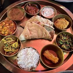 Mumbai 27 - Kolkata Thali: potatoes, chickpeas, dal, eggplant, raita, aloo tikki, okra, paneer, rice, naan
