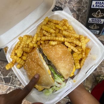 Rainbow Grocery - a person holding a container of fries and a sandwich - Beer, Wine & Spirits Near Me - New Orleans, Louisiana Rainbow Grocery - a person holding a container of fries and a sandwich - Beer, Wine & Spirits Near Me - New Orleans, Louisiana