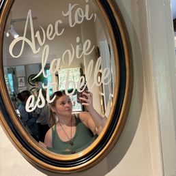 A mirror in the small shop located next door