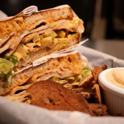 Daydreamer Coffee and Public House - Southwest Turkey Melt with pepper jack, jalapeno, chipotle mayo, lettuce, and red onion on rustic white