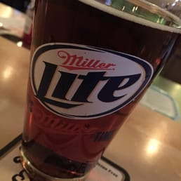 a glass of miller lite a glass of miller lite
