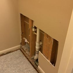 Superflow Plumbing - Holes cut in the walls to figure about the leaking