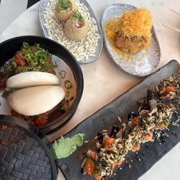 Steak and cheese, hamachi yaki puff, chefs snack sushi roll, bao bun Steak and cheese, hamachi yaki puff, chefs snack sushi roll, bao bun
