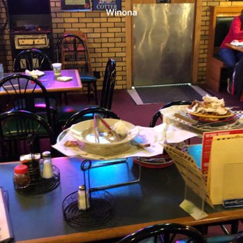 Sammy's Pizza - a woman sitting at a table in a restaurant - Pizza Near Me - Winona, Minnesota Sammy's Pizza - a woman sitting at a table in a restaurant - Pizza Near Me - Winona, Minnesota
