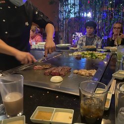 Umi Sushi and Steak House - Steak and chicken combo being prepared.
