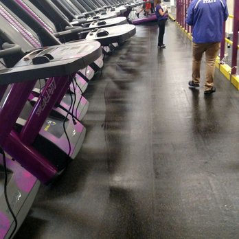 Planet Fitness - A row of treadmills tipped up so they could mop and vacuum underneath them - Gyms Near Me - West Seneca, New York