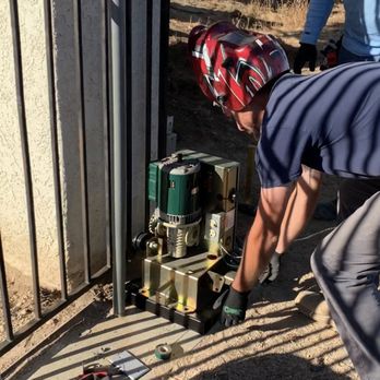 Gates Are Us - Dylan installing my motor. It's a sleek piece of equipment! - Fences & Gates Near Me