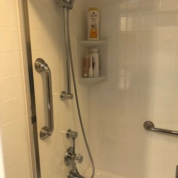 CALbath Renovations - Corner shelf with updated shower head. - General Contractors Near Me - Newport Beach, California CALbath Renovations - Corner shelf with updated shower head. - General Contractors Near Me - Newport Beach, California