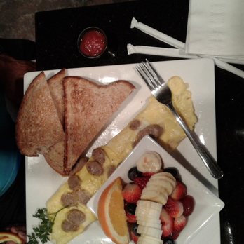 Keke's Breakfast Cafe - Omelettes come with toast and potatoes. Hubby chose fruit instead of the potatoes, which is an upcharge. - Breakfast & Brunch Near Me - Lutz, Florida Keke's Breakfast Cafe - Omelettes come with toast and potatoes. Hubby chose fruit instead of the potatoes, which is an upcharge. - Breakfast & Brunch Near Me - Lutz, Florida