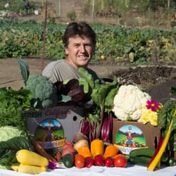 Ananda Valley Farm - Eric showing off the fall CSA boxes