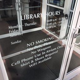 Hours posted on the South entry door Hours posted on the South entry door