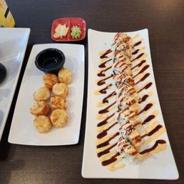 Tiger sushi on the right and Shumai on the left. Tiger sushi on the right and Shumai on the left.