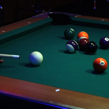 Babalouie's - a pool table with balls and cues - Sports Bars Near Me - Bonney Lake, Washington