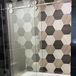 Frameless sliding glass door in master bath. Frameless sliding glass door in master bath.