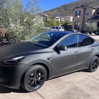 Dependable Guys - Matte black wrap, satin black powder coating on rims, satin black emblems for Tesla Model Y. - Auto Customization Near Me - Santa Ana, California Dependable Guys - Matte black wrap, satin black powder coating on rims, satin black emblems for Tesla Model Y. - Auto Customization Near Me - Santa Ana, California