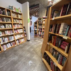 A Room of One's Own - Walls of books and local art!