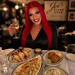 Joe's Stone Crab - Me enjoying my dinner date with crab claws lobster mac and crab cakes and can't forget the amazing Sauvignon Blanc the waiter recommended!