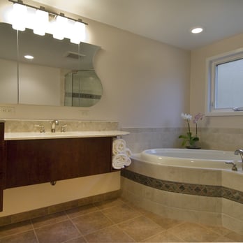 DreamMaker Bath & Kitchen - Floating cabinets with a custom mirror and sink in tub. - General Contractors Near Me - Ann Arbor, Michigan DreamMaker Bath & Kitchen - Floating cabinets with a custom mirror and sink in tub. - General Contractors Near Me - Ann Arbor, Michigan