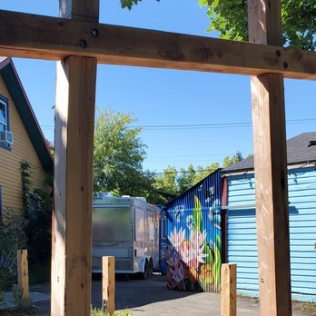 Honeycuspe - a view of a street through a wooden frame - Breakfast & Brunch Near Me - Portland, Oregon
