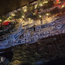 Oshucks Pub & Karaoke Bar - The walls are covered with money