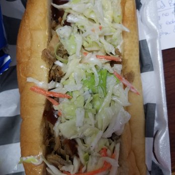 The Hibiscus Jerk Hut - BBQ Pulled Pork sandwich minis onions and peppers. Very good flavor. Could use a little more BBQ on the side. - Caribbean Near Me - Springfield, Missouri The Hibiscus Jerk Hut - BBQ Pulled Pork sandwich minis onions and peppers. Very good flavor. Could use a little more BBQ on the side. - Caribbean Near Me - Springfield, Missouri