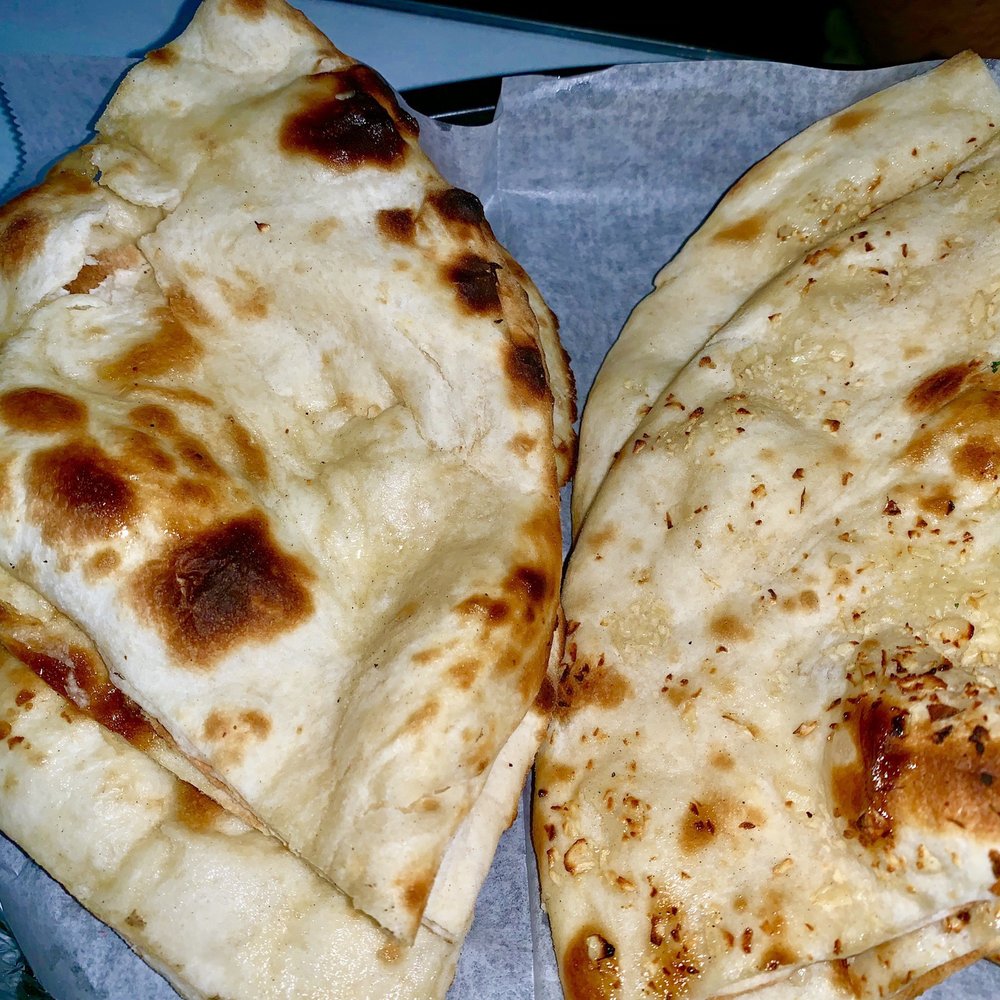 Minerva Indian Cuisine - Left: regular naan, right: Garlic Naan - Indian Near Me - Southlake, Texas Minerva Indian Cuisine - Left: regular naan, right: Garlic Naan - Indian Near Me - Southlake, Texas
