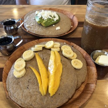 Sweet Cane Cafe - Oat/Buckwheat pancakes with fruit, and with avocado/goat cheese. Both with maple syrup. - Sandwiches Near Me - Hilo, Hawaii Sweet Cane Cafe - Oat/Buckwheat pancakes with fruit, and with avocado/goat cheese. Both with maple syrup. - Sandwiches Near Me - Hilo, Hawaii
