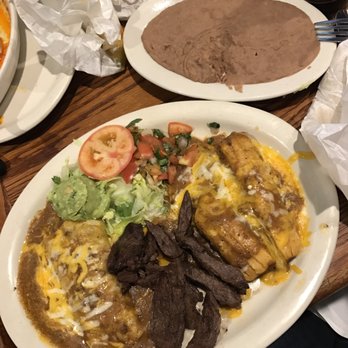 Don Carlos Mexican Restaurants - Tex-Mex Special - Chicken/Beef fajitas, tamale, ground beef enchilada with beef chili gravy and melted cheese. Guac, lettuce and tomato. - Mexican Near Me - Houston, Texas