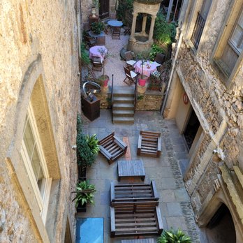 Hôtel d'Alibert - (Photo 1/2) Tables set for the generous breakfast in the interior courtyard. - Bed & Breakfast Near Me - Caunes-Minervois, 11 Hôtel d'Alibert - (Photo 1/2) Tables set for the generous breakfast in the interior courtyard. - Bed & Breakfast Near Me - Caunes-Minervois, 11