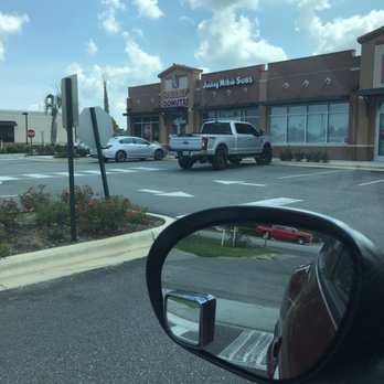 Dunkin' -  a view of a parking lot from a car window - Donuts Near Me - Daphne, Alabama