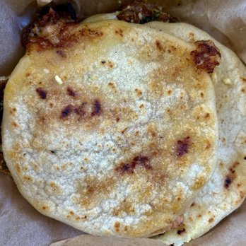 Pupusas Paradise - Three pupusas layered on top of each others - Salvadoran Near Me - Aurora, Colorado