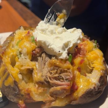 Wobbly Boots Roadhouse - Baked potato with pulled pork. - Barbeque Near Me - Osage Beach, Missouri